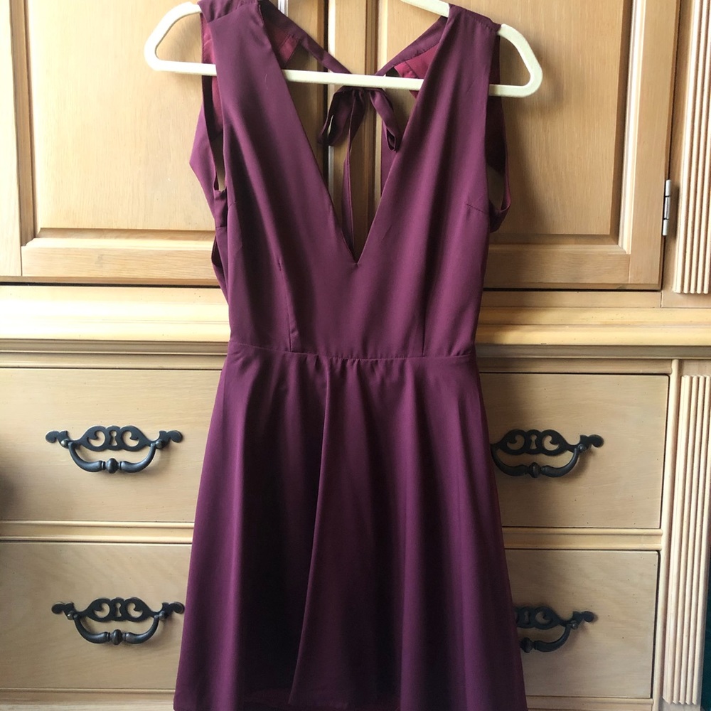 A maroon/burgundy swing dress with an open back